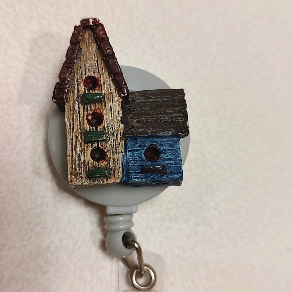 Bird house badge reel